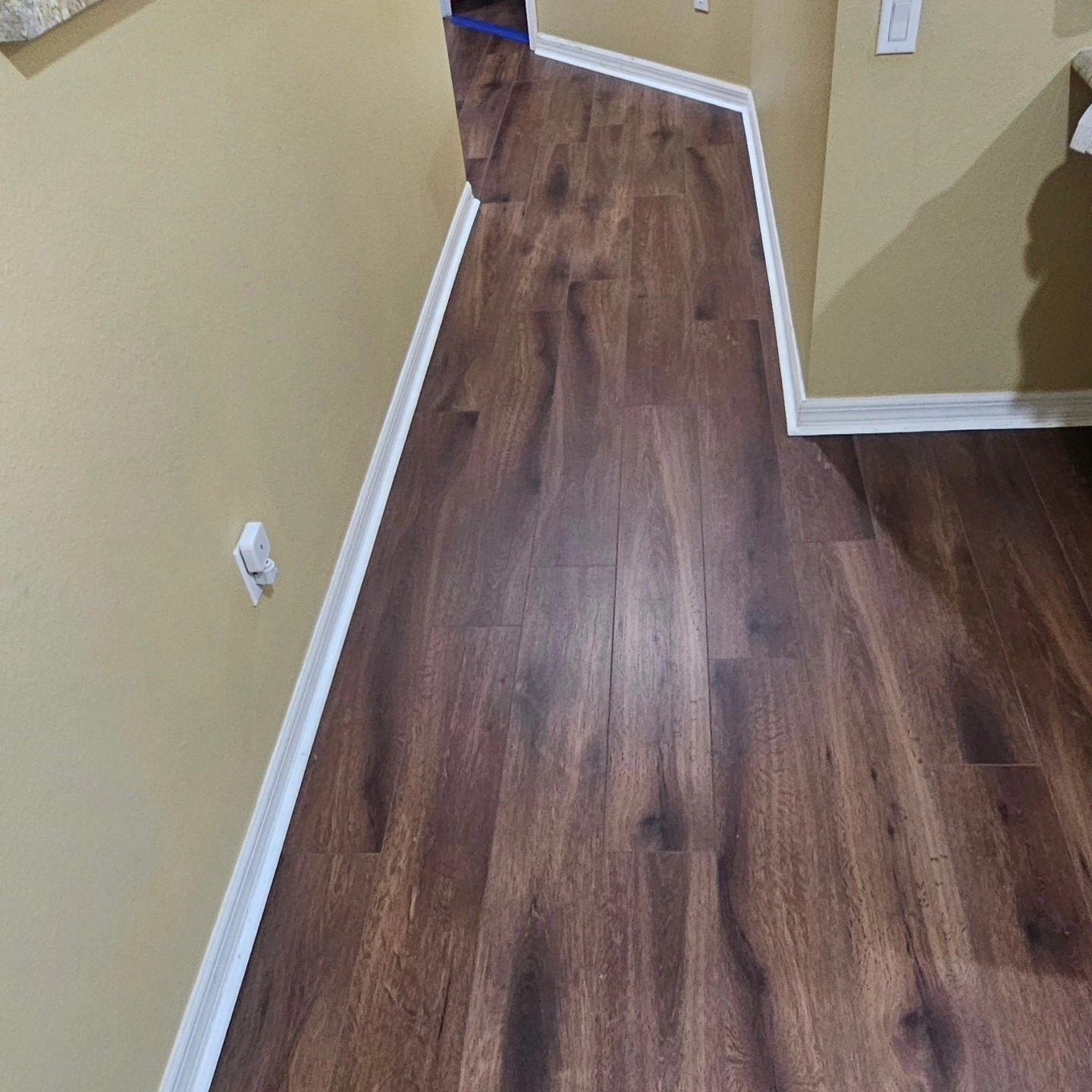 Brown hardwood hallway flooring